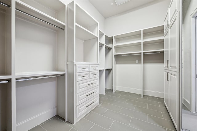 4615 Verone St, Bellaire, TX 77401 - spacious closet featuring tile patterned flooring