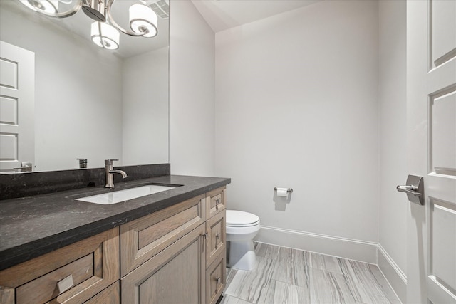 4615 Verone St, Bellaire, TX 77401 - bathroom featuring vanity and a chandelier