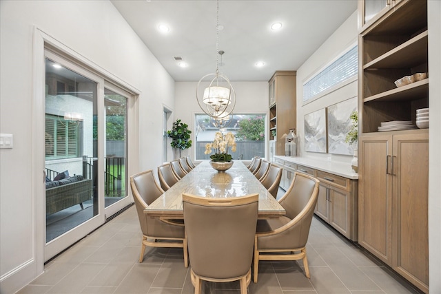 4615 Verone St, Bellaire, TX 77401 - dining area with a chandelier, recessed lighting, and light tile patterned floors