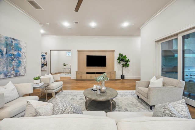 4615 Verone St, Bellaire, TX 77401 - living area featuring ornamental molding, a ceiling fan, and wood finished floors