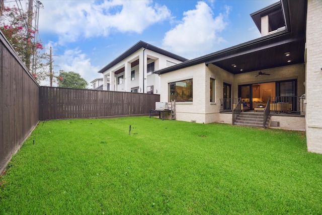 4615 Verone St, Bellaire, TX 77401 - fenced backyard with a ceiling fan and a porch