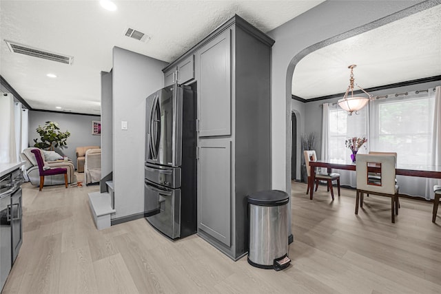 17103 Scuttle Way, Crosby, TX 77532 - kitchen with freestanding refrigerator, arched walkways, gray cabinets, light wood-type flooring, and recessed lighting