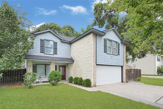 17103 Scuttle Way, Crosby, TX 77532 - traditional-style home with covered porch, concrete driveway, an attached garage, a shingled roof, and stone siding