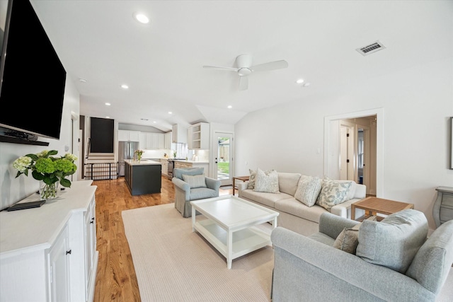2218 Gardenia Dr, Houston, TX 77018 - living area with a ceiling fan, vaulted ceiling, light wood-type flooring, and recessed lighting