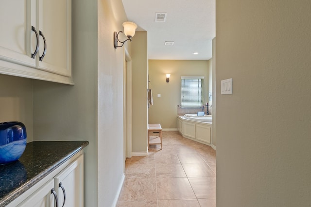 111 Bessie Price Owen Dr, Montgomery, TX 77356 - full bath with a garden tub, tile patterned flooring, and vanity