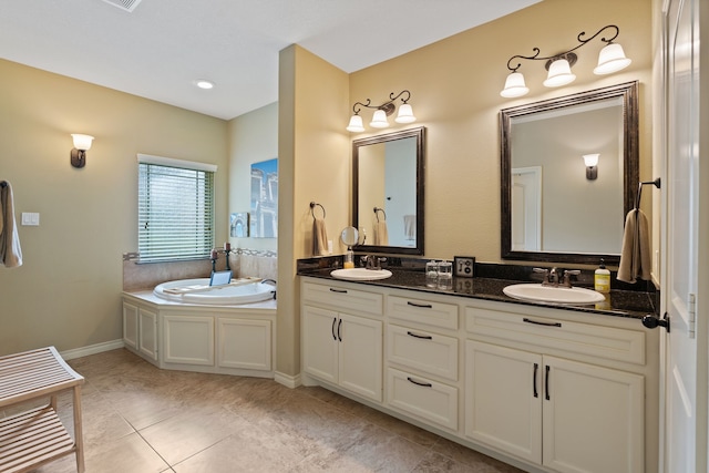 111 Bessie Price Owen Dr, Montgomery, TX 77356 - bathroom with double vanity, a garden tub, and tile patterned floors
