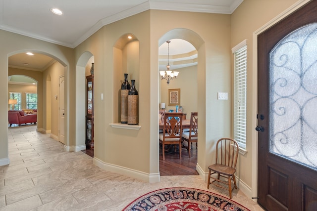 111 Bessie Price Owen Dr, Montgomery, TX 77356 - entrance foyer with arched walkways, crown molding, recessed lighting, and a chandelier