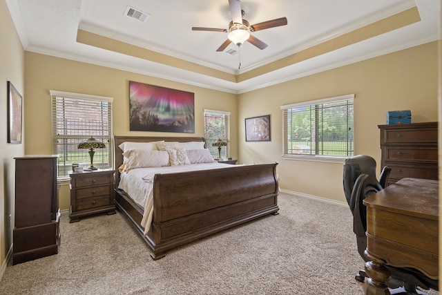 111 Bessie Price Owen Dr, Montgomery, TX 77356 - bedroom with a raised ceiling, ornamental molding, light colored carpet, ceiling fan, and an office area
