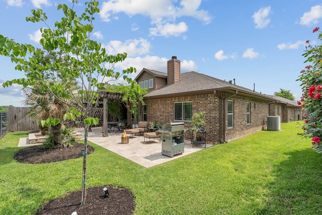 111 Bessie Price Owen Dr, Montgomery, TX 77356 - back of house featuring brick siding, a chimney, a fenced backyard, a patio, and roof with shingles