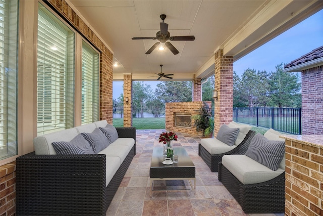 107 Lake View Loop, Fulshear, TX 77441 - view of patio / terrace with an outdoor living space with a fireplace and ceiling fan