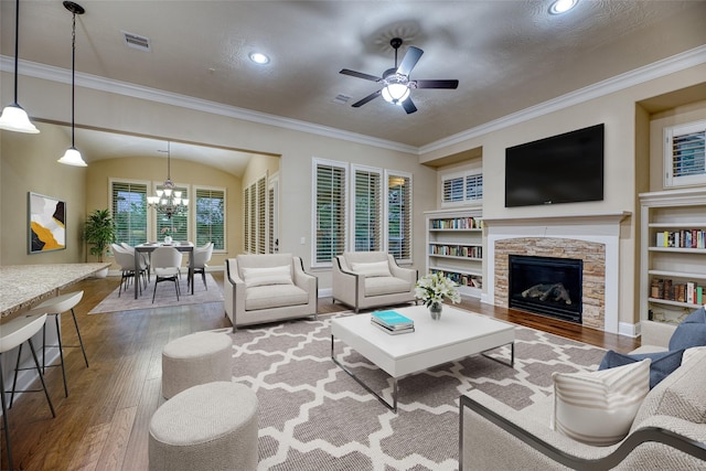 107 Lake View Loop, Fulshear, TX 77441 - living area featuring hardwood / wood-style floors, a chandelier, ceiling fan, built in features, and crown molding