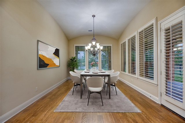 107 Lake View Loop, Fulshear, TX 77441 - dining space with light wood-style flooring, a chandelier, and lofted ceiling