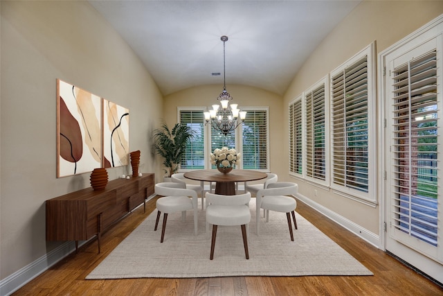 107 Lake View Loop, Fulshear, TX 77441 - dining room featuring vaulted ceiling, a chandelier, and wood finished floors