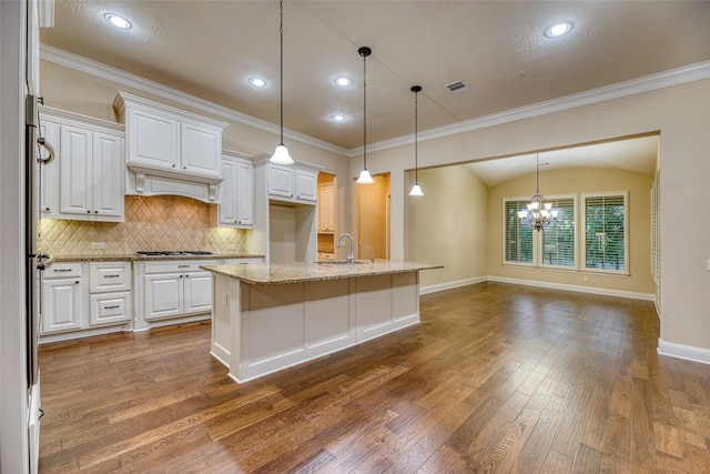 107 Lake View Loop, Fulshear, TX 77441 - kitchen featuring dark wood finished floors, white cabinets, tasteful backsplash, a chandelier, and recessed lighting