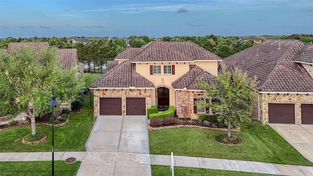 107 Lake View Loop, Fulshear, TX 77441 - mediterranean / spanish-style house with driveway, a front lawn, and a garage