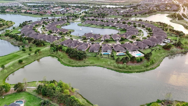 107 Lake View Loop, Fulshear, TX 77441 - aerial overview of property's location with nearby suburban area and a large body of water