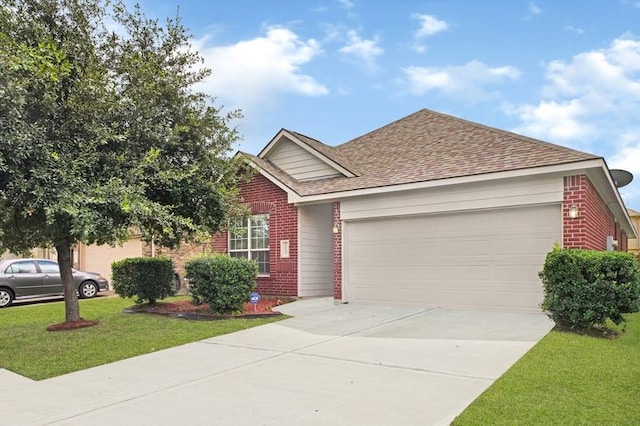 15806 Marble Bluff Ln, Houston, TX 77049 - ranch-style house with brick siding, an attached garage, a front lawn, and driveway