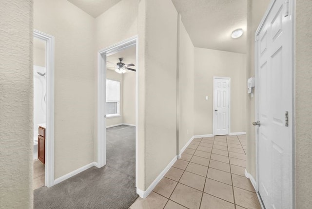 15806 Marble Bluff Ln, Houston, TX 77049 - hall with light tile patterned floors and baseboards