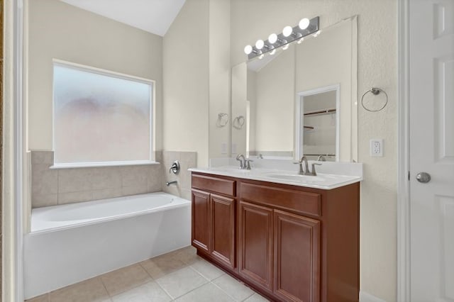 15806 Marble Bluff Ln, Houston, TX 77049 - bathroom with tile patterned flooring, a garden tub, and double vanity