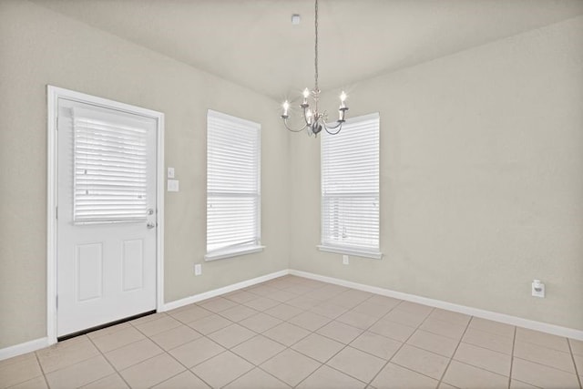 15806 Marble Bluff Ln, Houston, TX 77049 - unfurnished dining area featuring a chandelier and baseboards