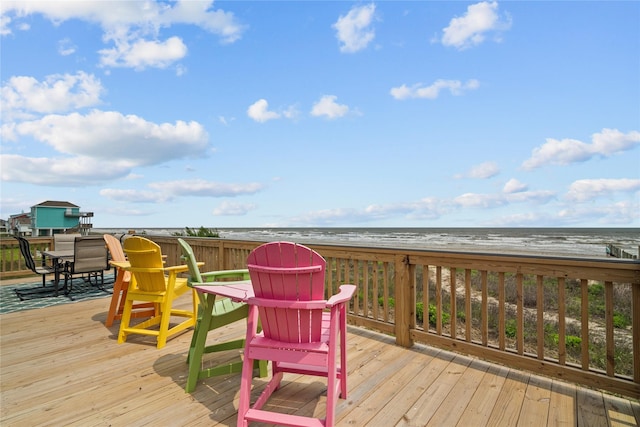 21446 Gulf Dr, Galveston, TX 77554 - deck featuring view of water and beach and outdoor dining area