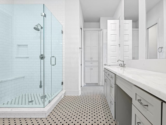 1110 W 12th St, Houston, TX 77008 - full bath with vanity, a shower stall, and tile patterned floors