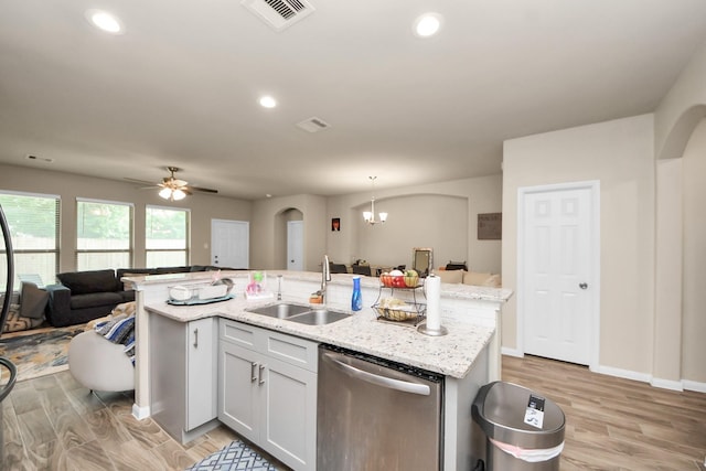 7947 Cinderella St, Houston, TX 77028 - kitchen featuring dishwasher, open floor plan, light wood-style flooring, arched walkways, and a ceiling fan