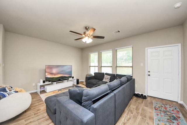 7947 Cinderella St, Houston, TX 77028 - living area with ceiling fan and light wood finished floors