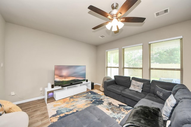 7947 Cinderella St, Houston, TX 77028 - living area with wood finished floors and a ceiling fan