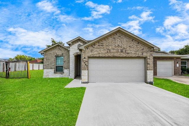 7947 Cinderella St, Houston, TX 77028 - french country inspired facade featuring a garage, concrete driveway, brick siding, and stone siding