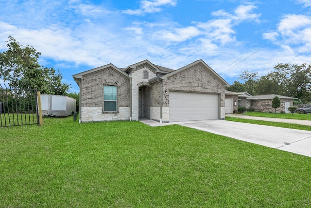 7947 Cinderella St, Houston, TX 77028 - view of front facade featuring an attached garage, driveway, stone siding, and brick siding