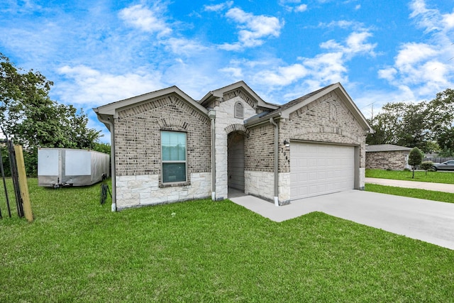 7947 Cinderella St, Houston, TX 77028 - french country style house with an attached garage, driveway, brick siding, and a front yard