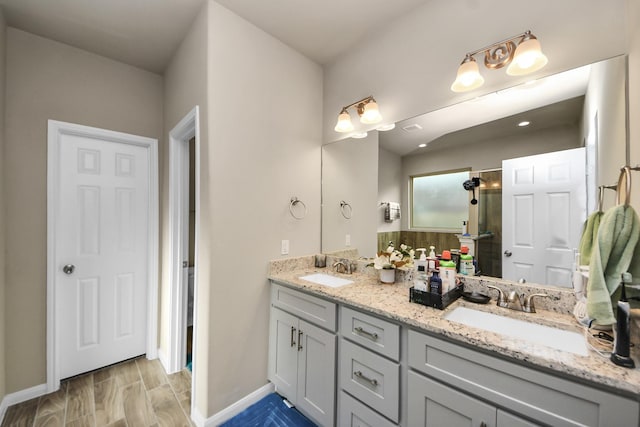 7947 Cinderella St, Houston, TX 77028 - bathroom with double vanity and a shower stall