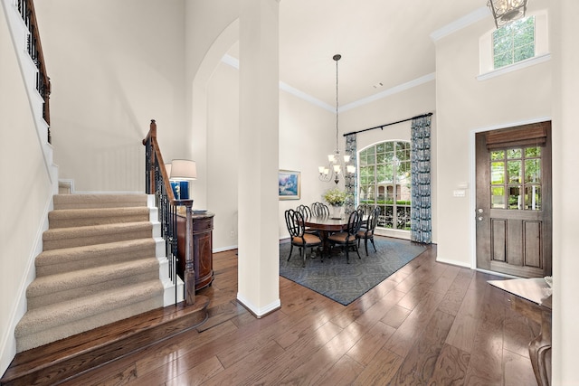 18331 Chapmans Count Rd, Cypress, TX 77433 - entrance foyer with a high ceiling, healthy amount of natural light, stairs, dark wood-type flooring, and a chandelier