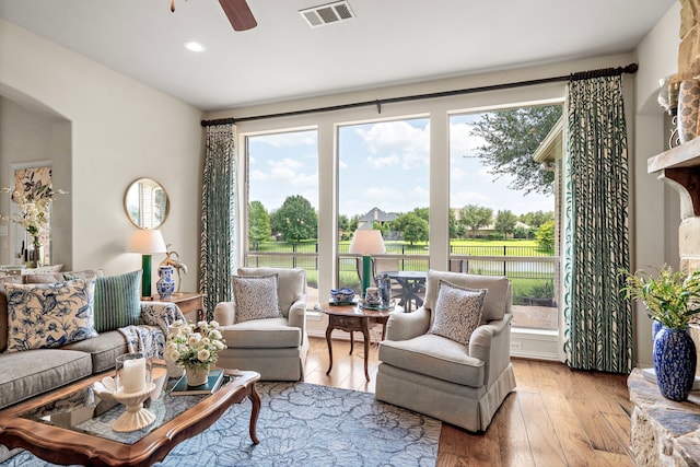 18331 Chapmans Count Rd, Cypress, TX 77433 - living room with a ceiling fan, hardwood / wood-style floors, recessed lighting, and arched walkways