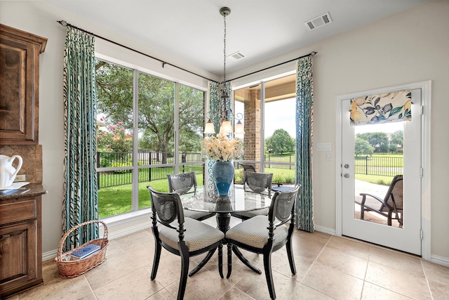 18331 Chapmans Count Rd, Cypress, TX 77433 - dining space with light tile patterned floors and a chandelier
