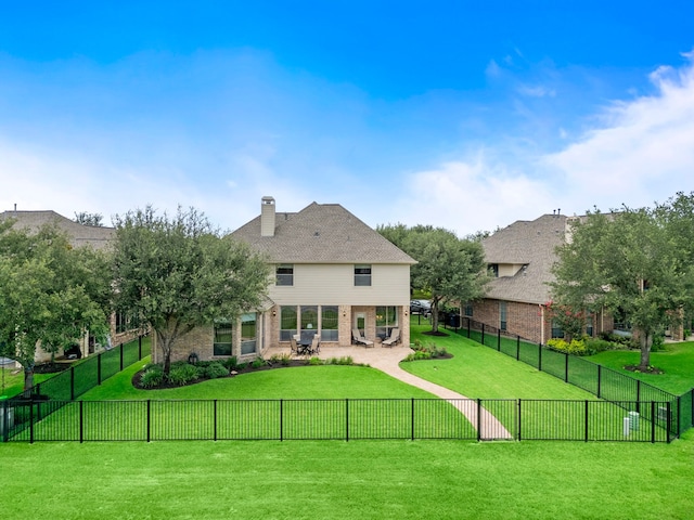 18331 Chapmans Count Rd, Cypress, TX 77433 - back of house with a patio area, brick siding, and a chimney