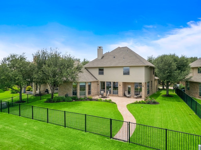 18331 Chapmans Count Rd, Cypress, TX 77433 - rear view of house with brick siding, a patio, and a chimney