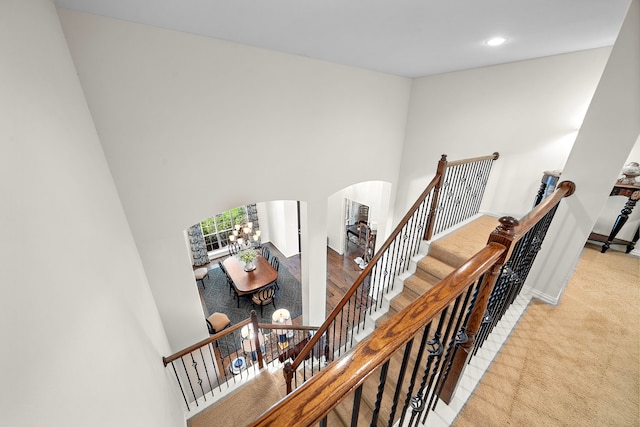 18331 Chapmans Count Rd, Cypress, TX 77433 - stairs with arched walkways, carpet flooring, and recessed lighting