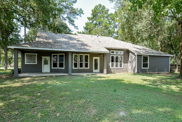 18110 Auburn Dr, Tomball, TX 77375 - view of front of home featuring a front lawn and roof with shingles