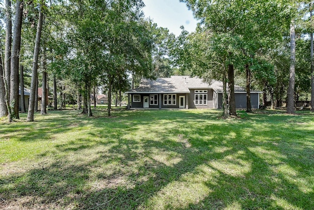 18110 Auburn Dr, Tomball, TX 77375 - view of grassy yard featuring a garage