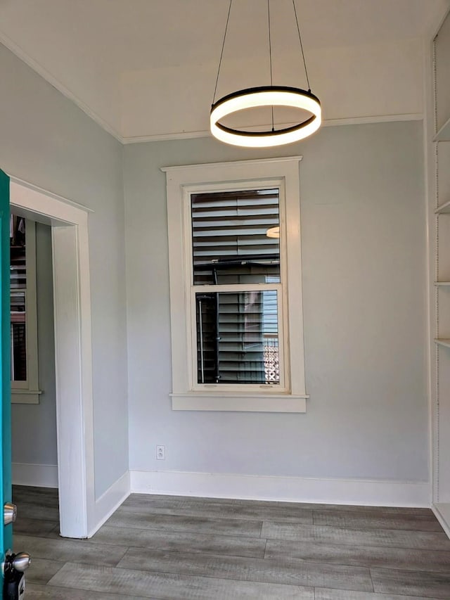 1805 39th St, Galveston, TX 77550 - unfurnished room with wood finished floors and baseboards