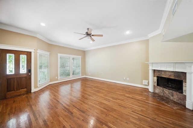 606 E 27th St, Houston, TX 77008 - unfurnished living room with ceiling fan, wood finished floors, a tile fireplace, crown molding, and recessed lighting