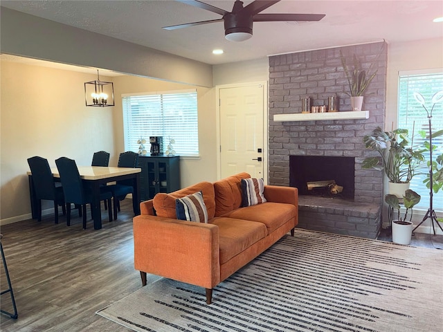 4822 Glendower Dr, Spring, TX 77373 - living area with ceiling fan, wood finished floors, a fireplace, a chandelier, and recessed lighting