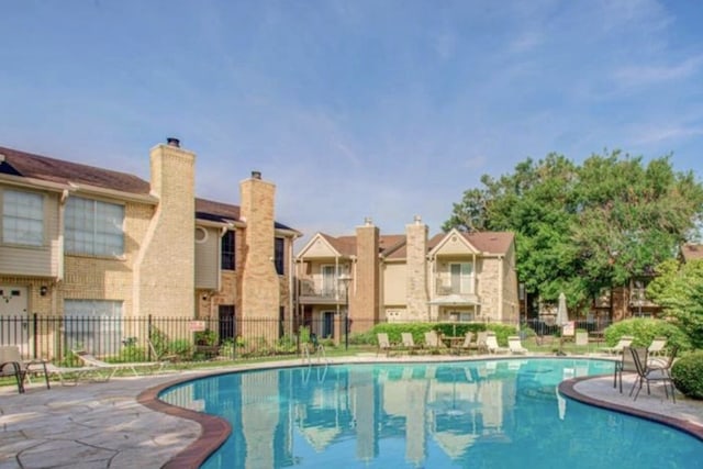 3600 Jeanetta St Unit 1602, Houston, TX 77063 - community pool with a patio area