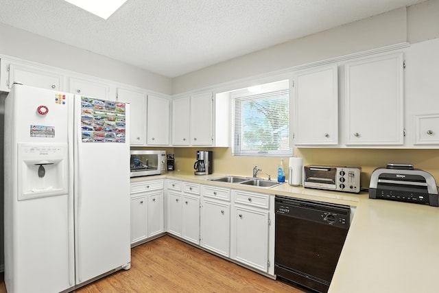 2910 Riata Ln, Houston, TX 77043 - kitchen featuring white refrigerator with ice dispenser, dishwasher, light wood-style floors, white cabinets, and light countertops