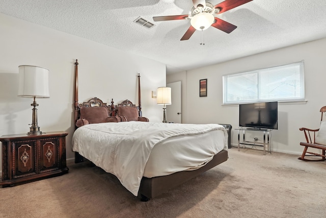 2910 Riata Ln, Houston, TX 77043 - bedroom featuring light colored carpet, a textured ceiling, and a ceiling fan