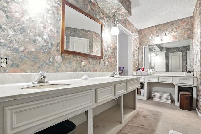 2910 Riata Ln, Houston, TX 77043 - bathroom with double vanity, wallpapered walls, and a textured ceiling