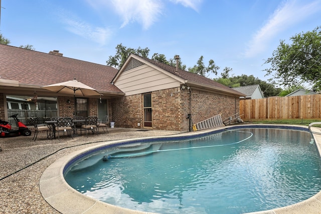 2910 Riata Ln, Houston, TX 77043 - view of swimming pool featuring a patio