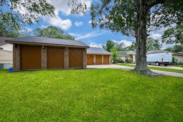 19923 Ricewood Way, Katy, TX 77449 - view of grassy yard with a garage and driveway